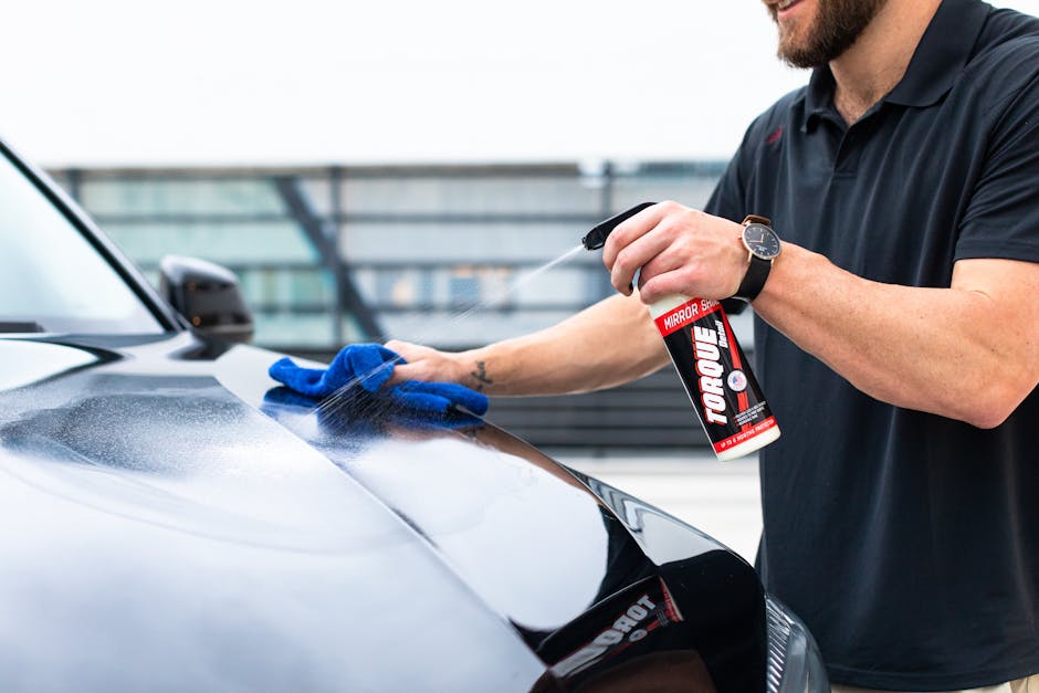 Microfiber cloth wiping car surface